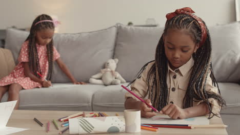 african girl with braids drawing
