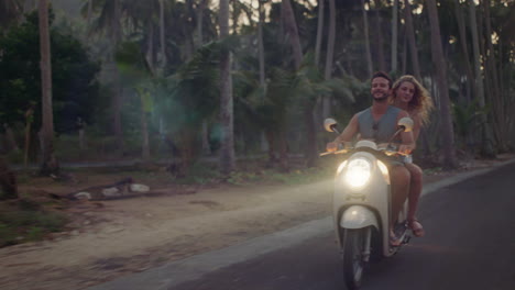 happy couple riding scooter on tropical island at sunrise enjoying romantic ride exploring beautiful travel destination on motorcycle