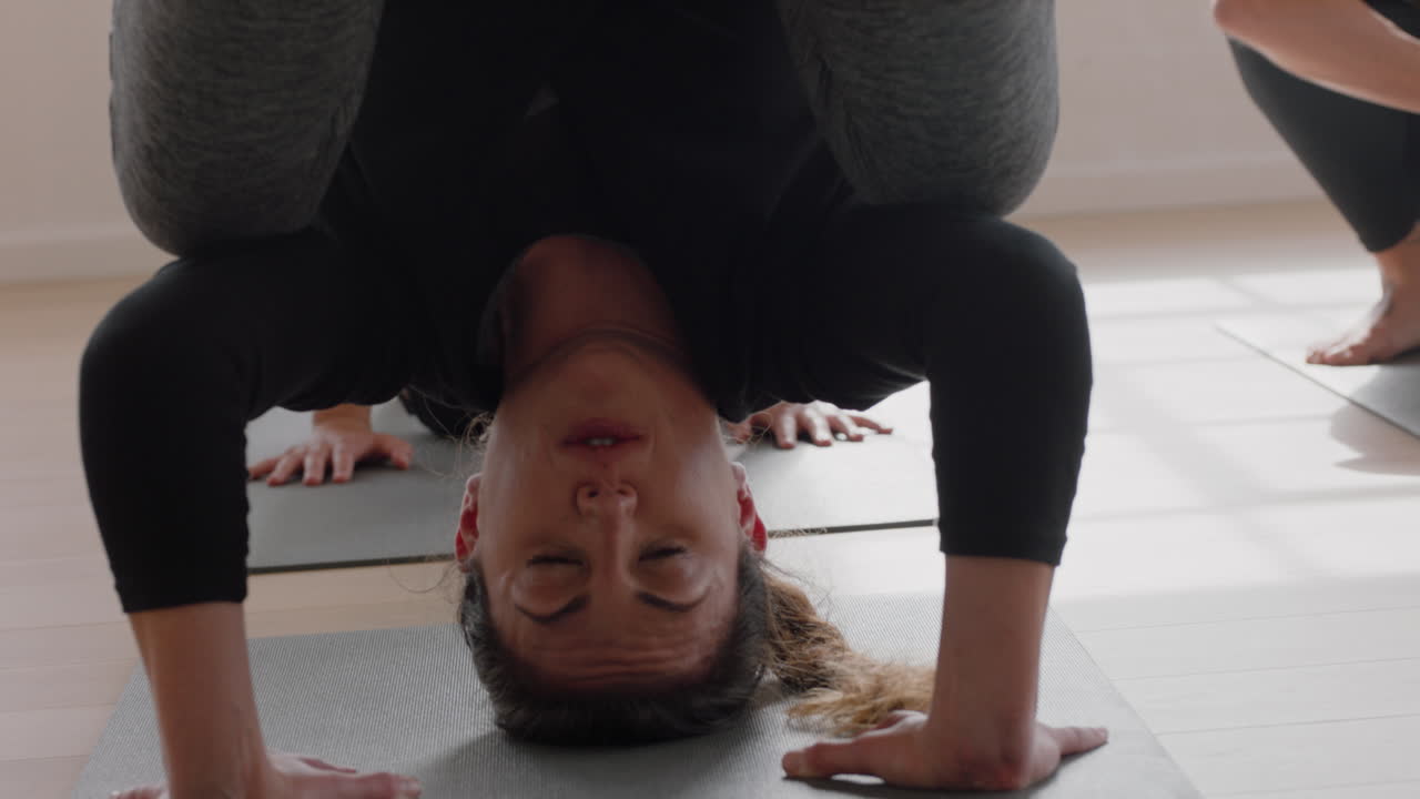 healthy caucasian yoga woman practicing crow pose meditation enjoying exercising flexible body in fitness class