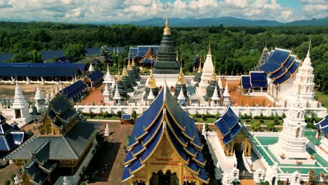 4k cinematic nature aerial drone footage of the beautiful temple of wat ban den next to chiang mai, thailand on a sunny day