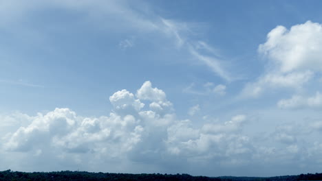 cloud and blue sky timelape of dramatic fast moving white clouds on sunny blue sky