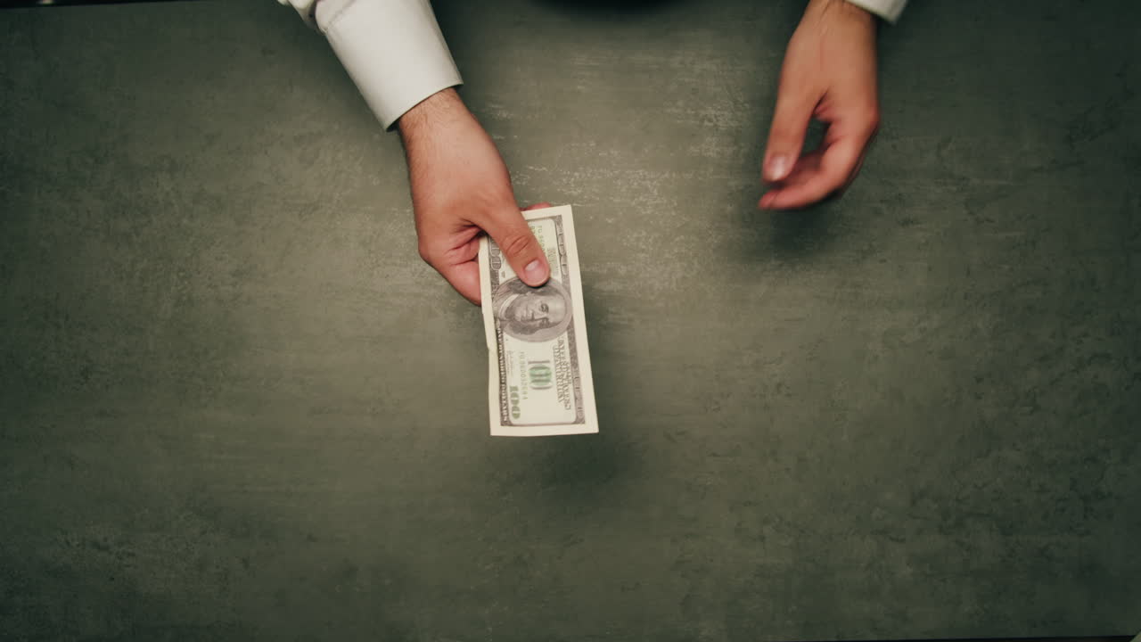 Specialised police officer Counting dollar banknotes in crime lab, conceptual image. High quality 4k footage