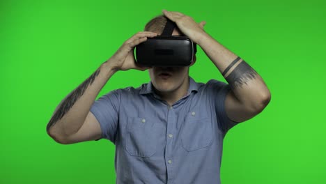 man using vr headset helmet to play game. watching virtual reality 3d 360 video. chroma key