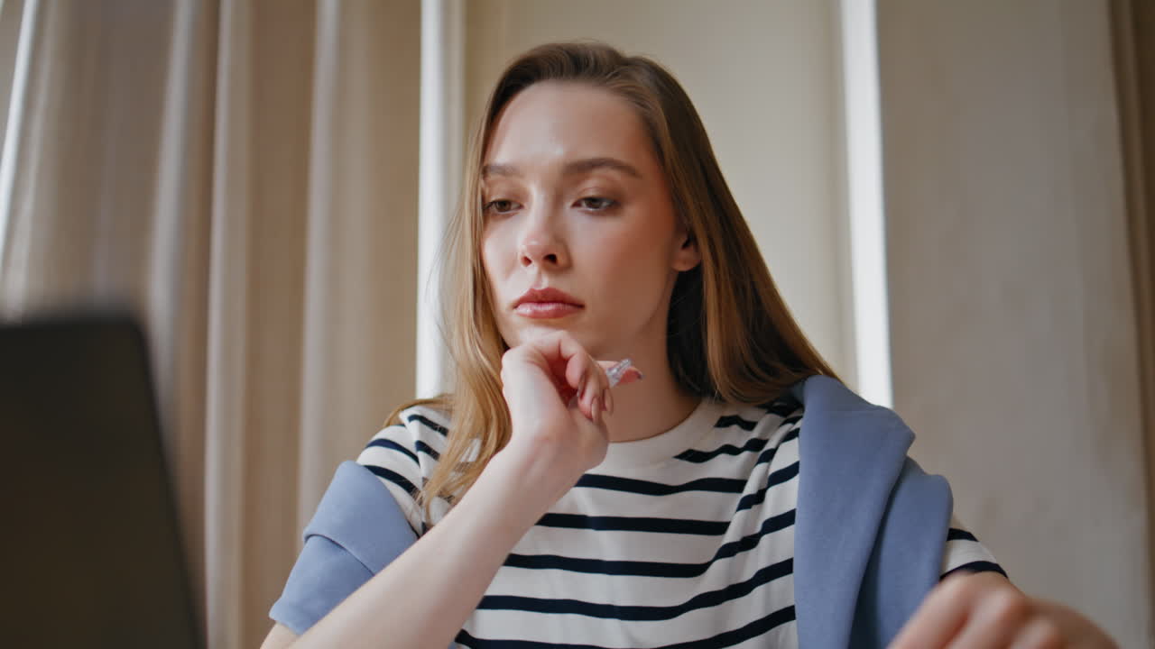 Businesswoman analyzing financial documents in office environment closeup