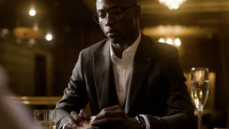 man playing poker at the casino.