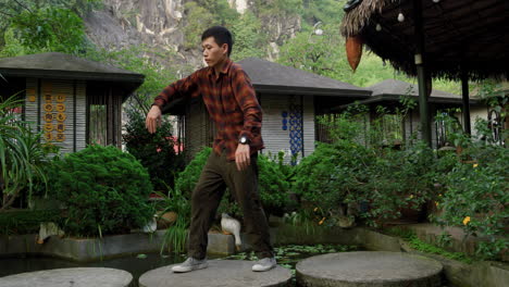 young asian dancer doing breakdancing at the park in vietnam