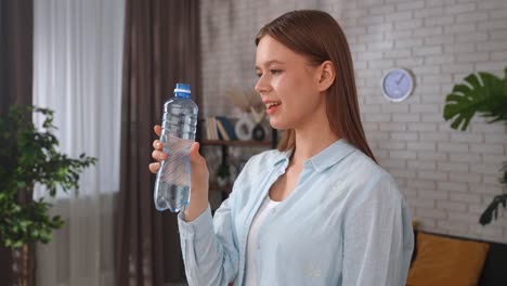 young woman drinking fresh water from a clean forest stream young woman drinking fresh water from a clean forest stream in summer pure nature peace and refreshment a quiet moment in the wilderness symbol of connection with nature and natural living