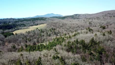 Aerial-Push-in-Grandfather-Mountain-NC,-Grandfather-Mountain-NC-in-Background-shot-from-Watauga-County-in-Foreground-near-Boone-NC,-Boone-North-Carolina