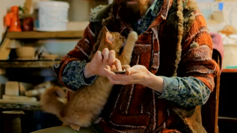 professional male potter working in workshop, studio