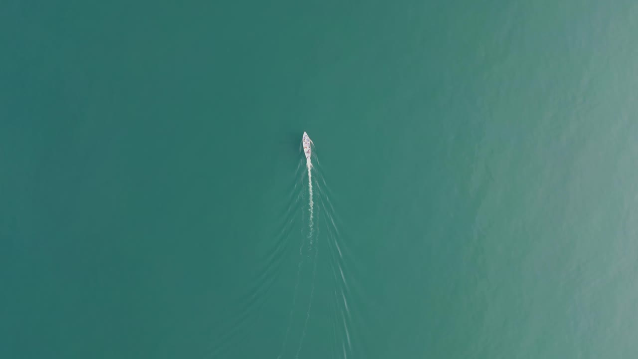 Yacht And Boats Floating In The Calm Blue Waters Of Lake Garda In Italy