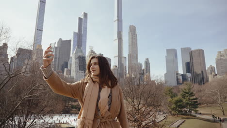 woman taking selfie in central park, new york city