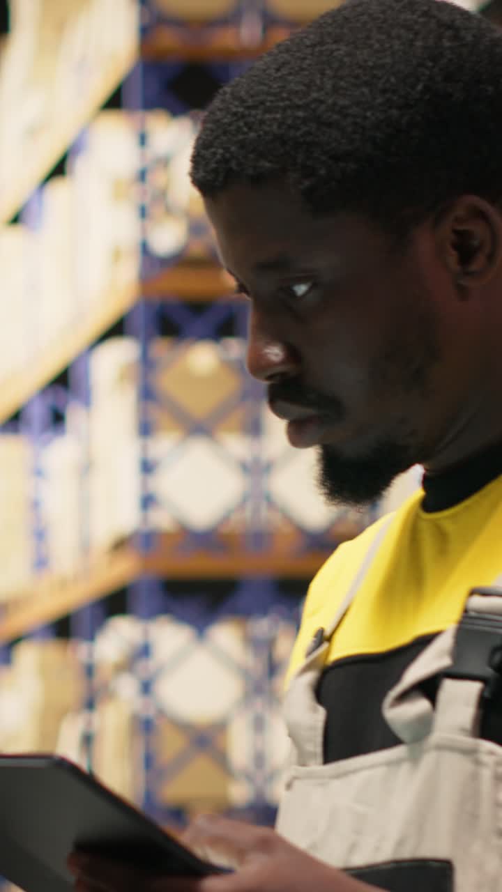 Vertical Video African american e-commerce worker scanning shipping labels numbers