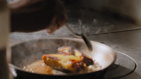 sautéing sweet potatoes in a sweet brown sauce in slow motion