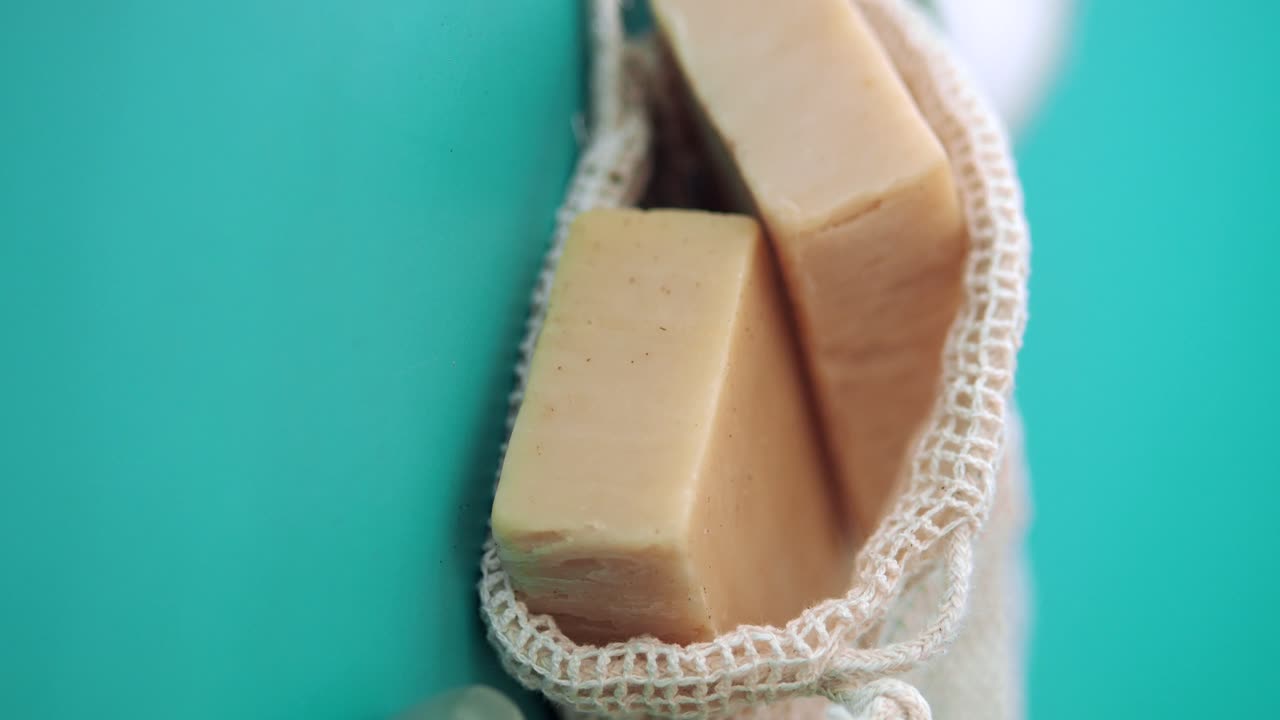Soap in a soap bag with exfoliating tool