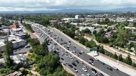 us highway route 101 through hollywood, california - aerial flyover during heavy traffic