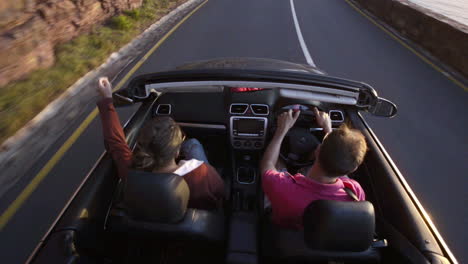 couple driving convertible car cabriolet cape town south africa steadicam shot