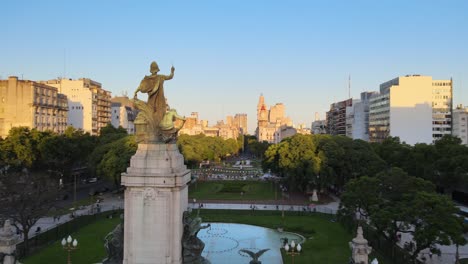 aerial orbit of bronze monument in congressional plaza near argentine congress building at sunsetbuenos aires