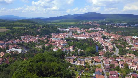 Fantastic-aerial-top-view-flight-mountain-overview-Hill-town-Panorama,-Krumlov-Czech-Republic-Summer-2023