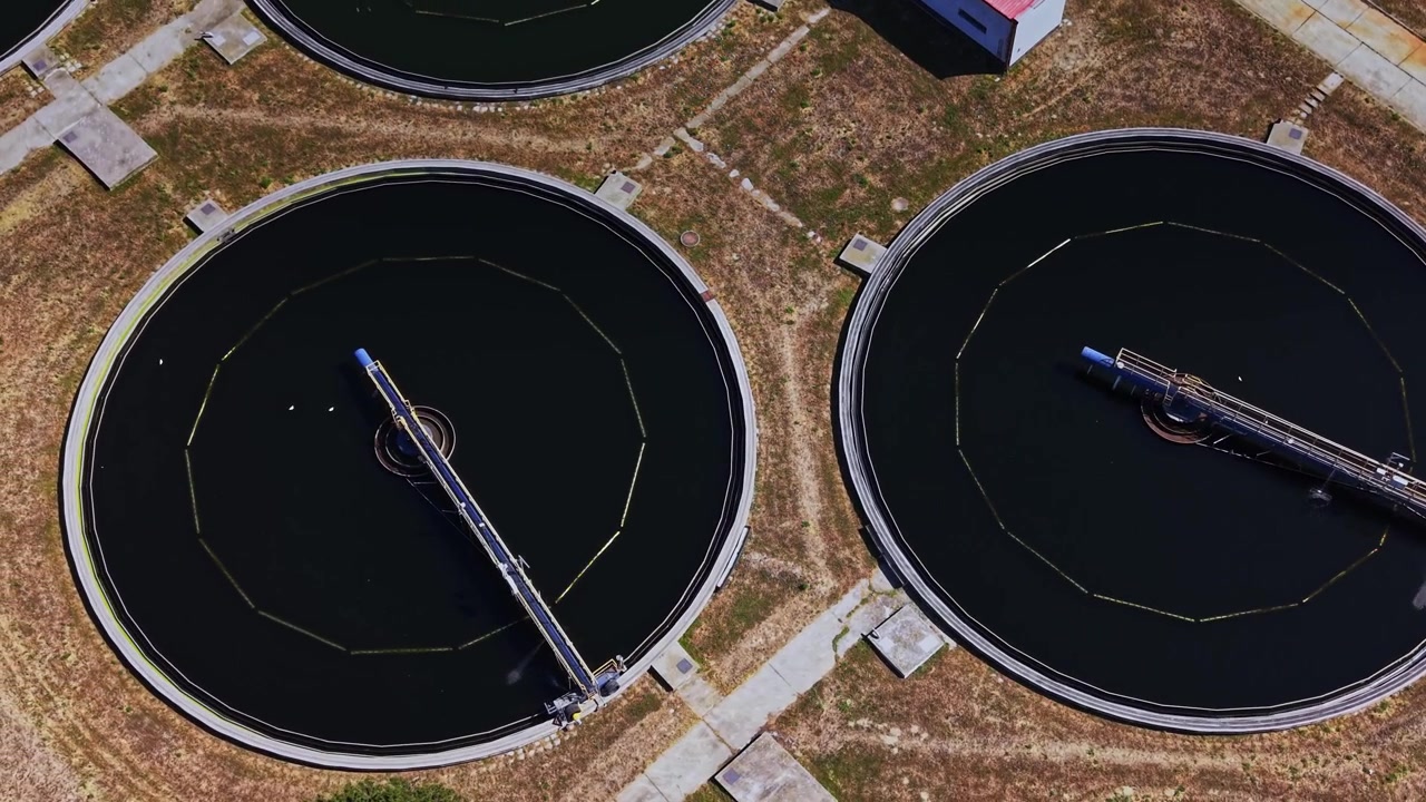 Water treatment facility with circular tanks and structures above ground