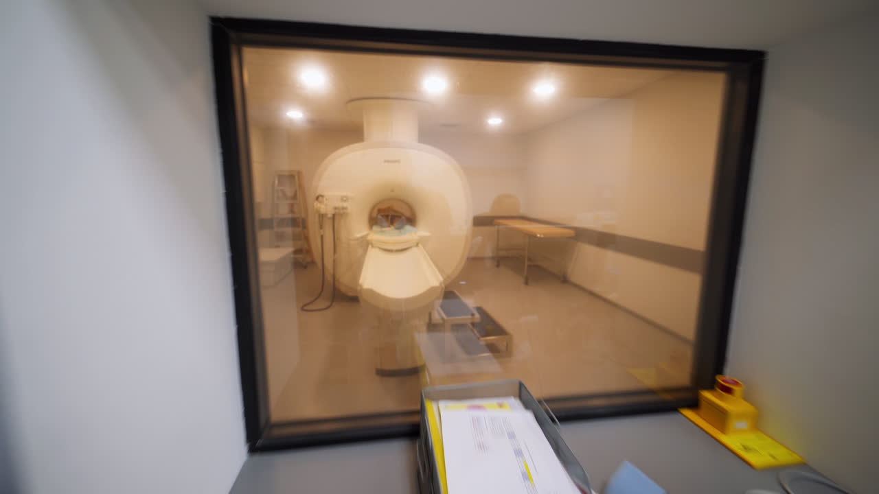 Medical Imaging Room with Staff and MRI Machine