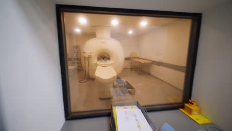 Medical Imaging Room with Staff and MRI Machine