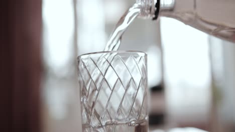 clean drinking water poured into a glass.