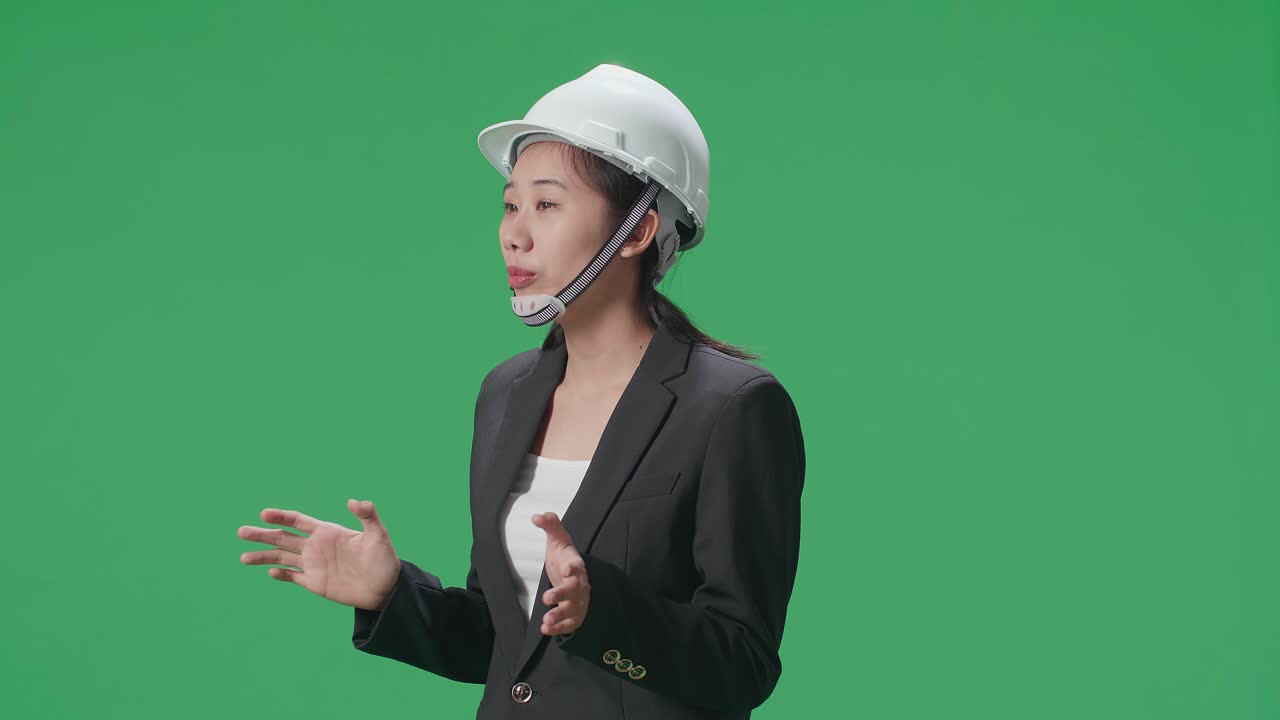 Asian businesswoman in a suit and hard hat
