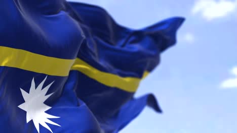 detail of the national flag of nauru waving in the wind on a clear day