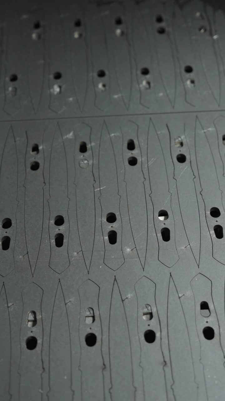 Vertical - metal board in cnc machine with knife shape lines, Czechia