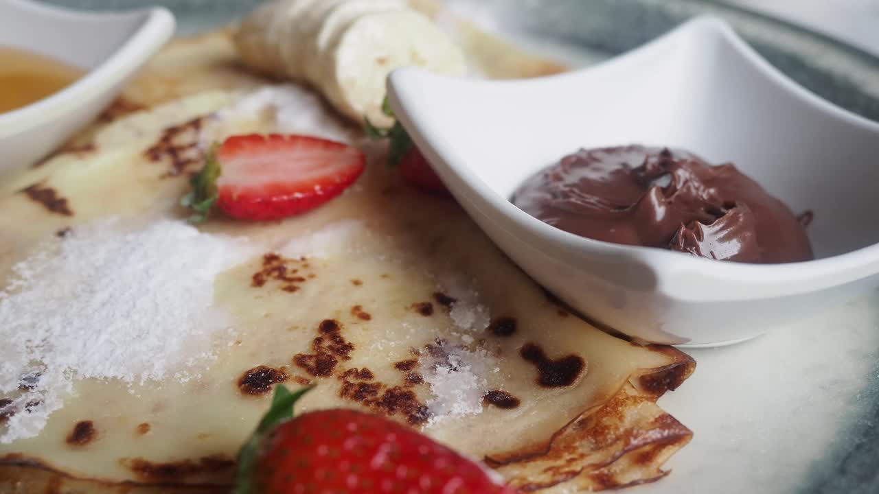 Pancakes with Strawberries, Banana, and Chocolate