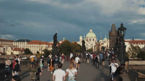 prague, czech republic tourists strolling over the famous charles bridge at old town