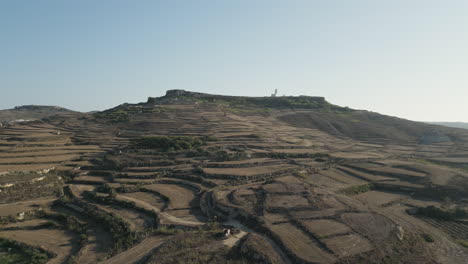 aerial footage, landscape of gozo with lighthouse