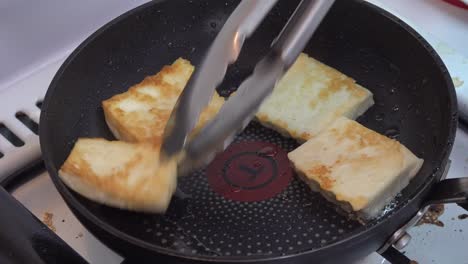 pieces of cheese roasting on a pan