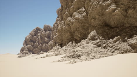 a desert landscape with a rock formation