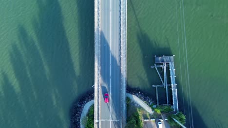 drone aerial of freeway highway bridge crossing lake water with wharf central coast toukley budgewoi central coast australia