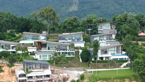 drone view of a magnificent residential area of several high-end villas on a thai hillside