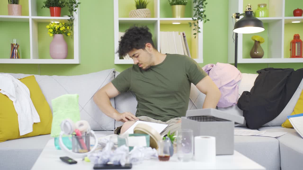 A neglected man who can't find what he's looking for in his messy house.