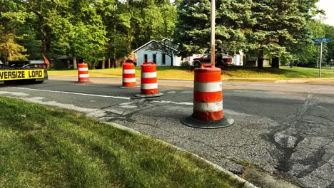 Round-traffic-barrels-on-a-road