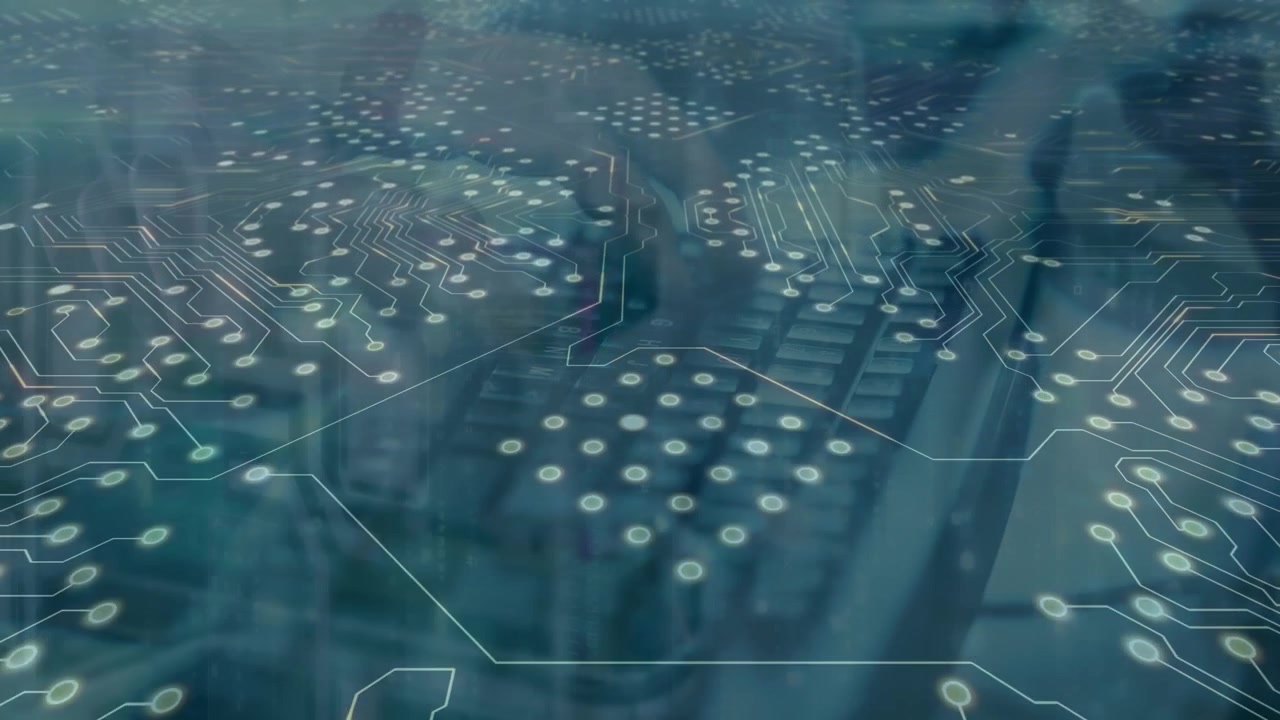Digital Circuit Board Overlay on Person Typing on Laptop