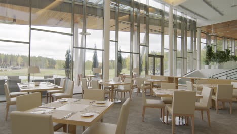 modern empty restaurant dining area with panoramic windows
