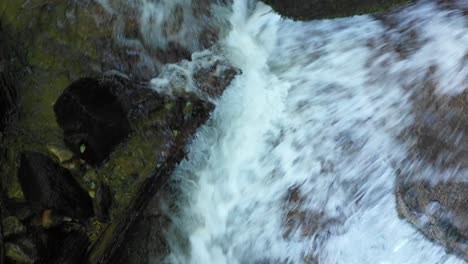 mountain river flowing over rocks and boulders in forest, bistriski vintgar gorge on pohorje mountain, slovenia, ecology clean water concept, natural resources, birds eye view from above