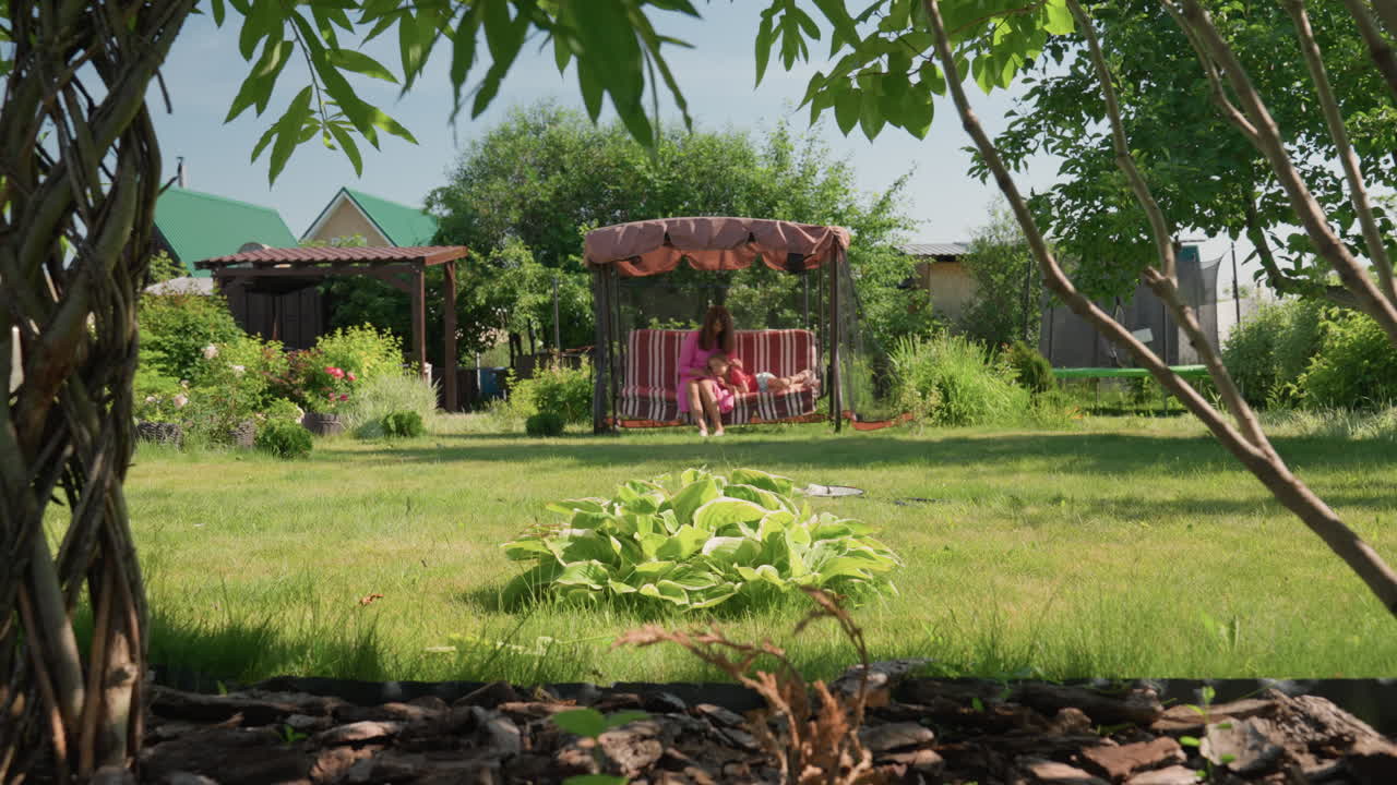 Tranquil Natural Environment, Serene Outdoor Garden Scene, Relaxing Summer Landscape With Lush Greenery And Swing, Peaceful Outdoor Setting Featuring Vibrant Flora And Comfortable Bench