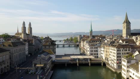 dramatic establishing shot along limmat river in zurich, switzerland