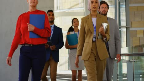 business people walking in the corridor at office 4k