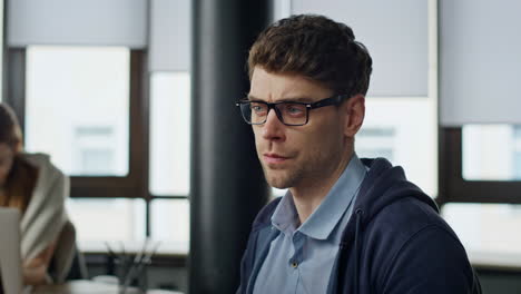 pensive entrepreneur looking computer at office closeup. stressed man developer