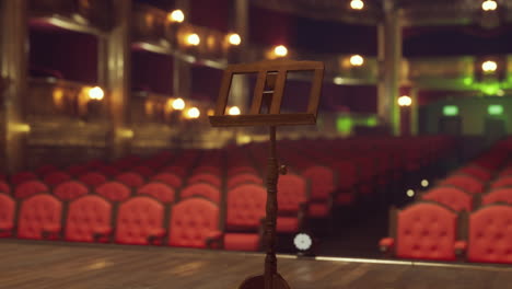 empty theater stage with music stand