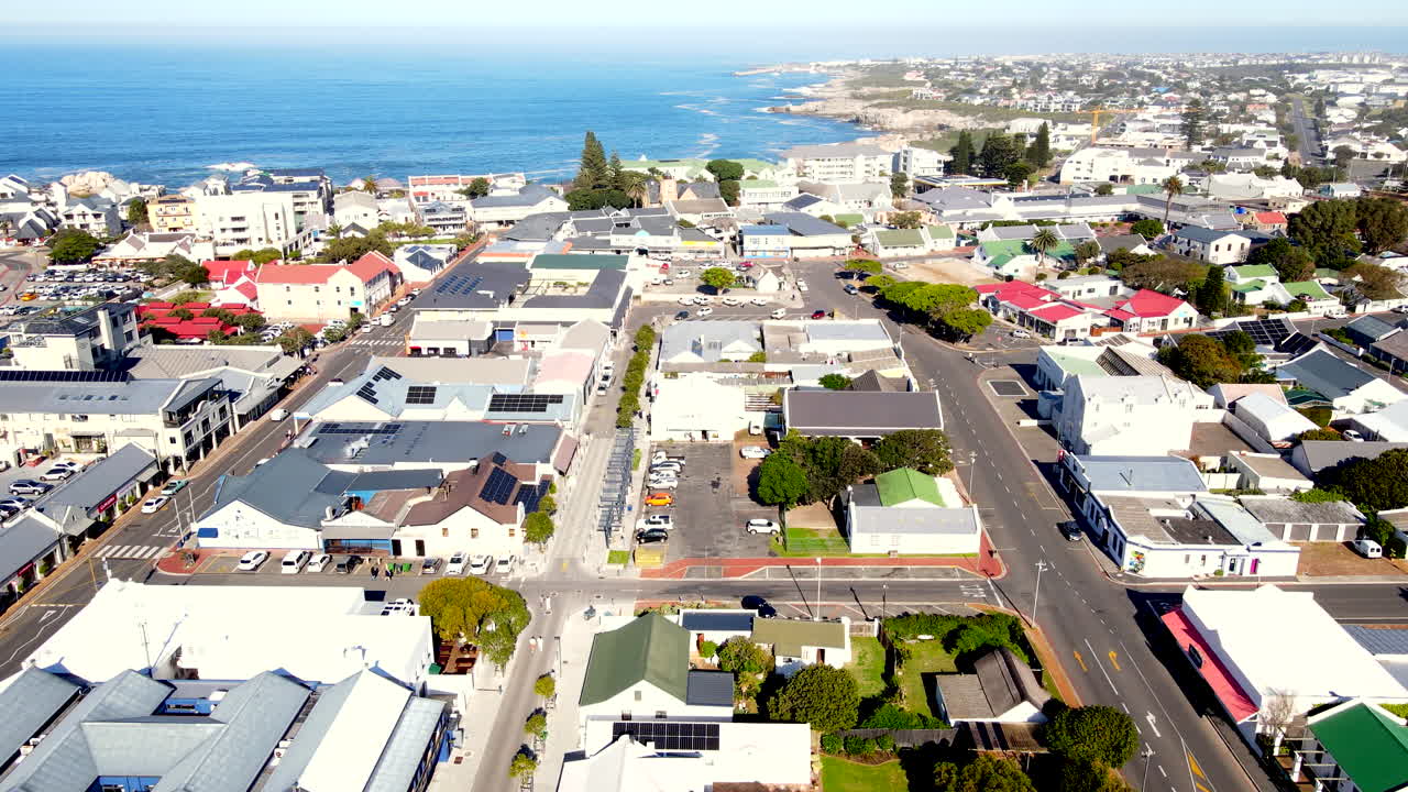 Aerial descending view over Hermanus CBD toward Westcliff coastline