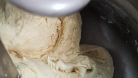 mixing dough in a kitchen mixer