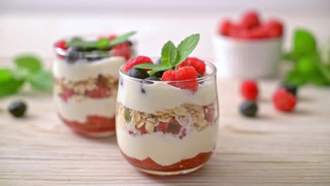 homemade raspberry and blueberry with yogurt and granola - healthy food style