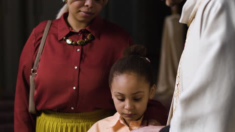 Mother-and-daughter-at-the-church-on-Sunday